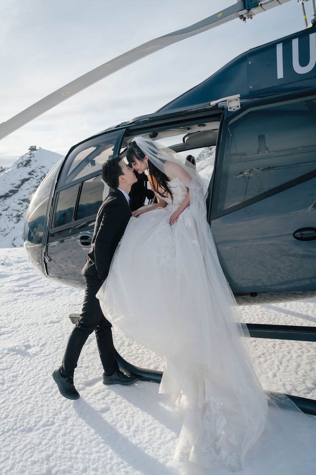 Helicopter landing alpine elopement New Zealand