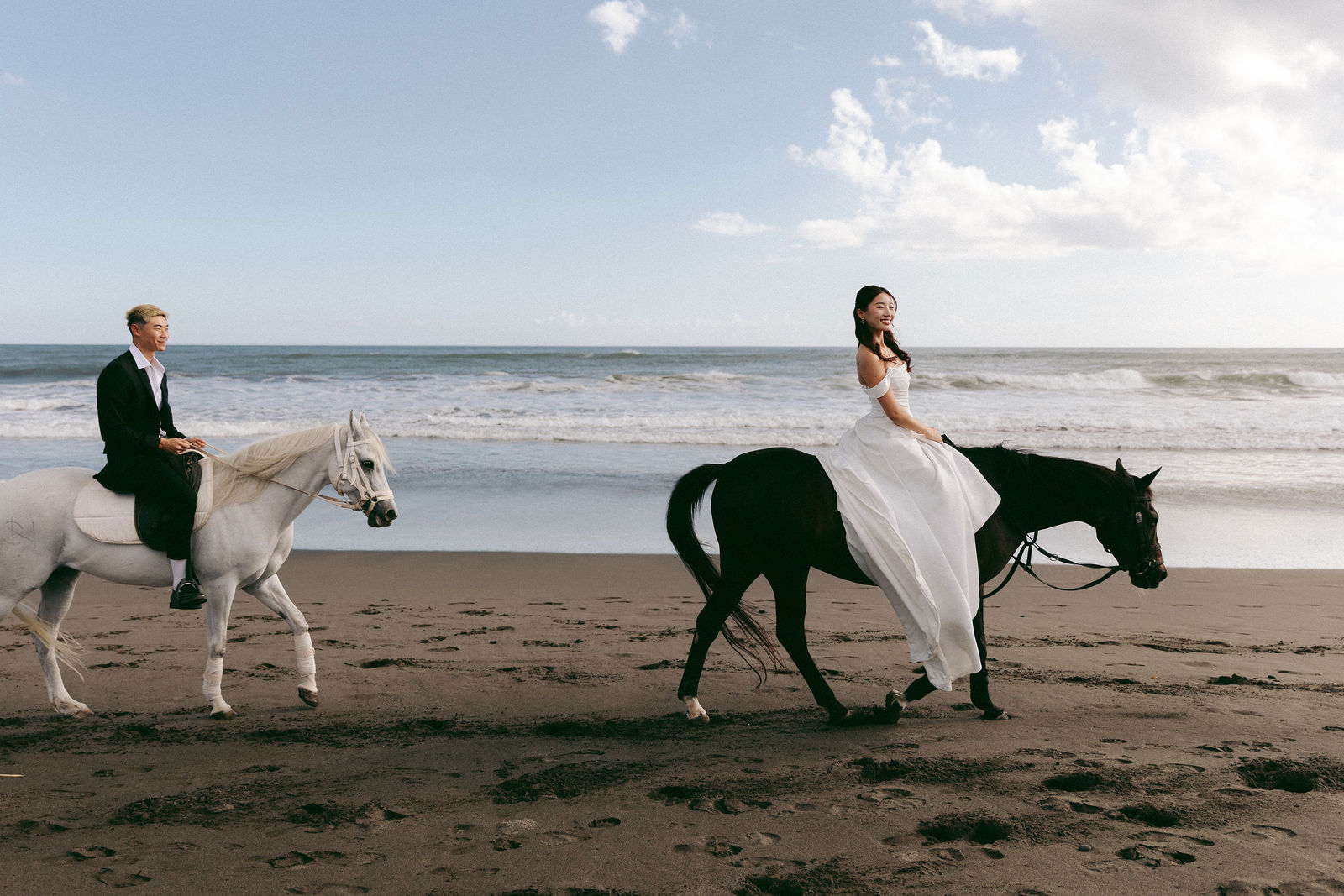 Couple horse riding along a Bali beach